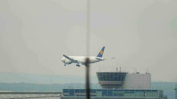 FRANKFURT AM MAIN, GERMANY JULY 19, 2017 - Long shot, Lufthansa Boeing 777 cargo plane approaching to land at Frankfurt International Airport FRA video