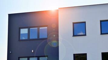 Modern apartment buildings on a sunny day with a blue sky. Facade of a modern apartment building photo