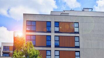 Eco architecture. Green tree and apartment building. The harmony of nature and modernity. photo