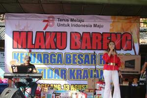 Magelang, Indonesia. 17 08 2023-a dangdut singer is singing at the Indonesian Anniversary celebration on the stage. photo