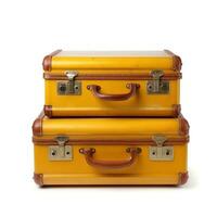 Retro yellow suitcases isolated photo