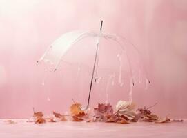 Pink background with autumn leaves and umbrella photo