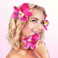 Happy female with orchid flower photo