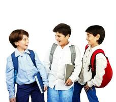 Happy schoolboys isolated on white photo