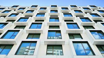 The facade of the new apartment building shaped like cubes. Minimalist  apartment building of a cube structure. photo