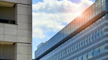 Modern office building in the city with windows and  steel and aluminum panels wall. Contemporary commercial architecture, vertical converging geometric lines. photo