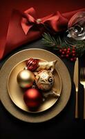 Christmas table setting with christmas gold and red dinnerware photo