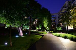 Exterior of apartment building at night photo