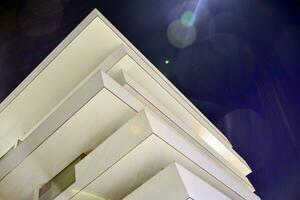 Exterior of apartment building at night photo