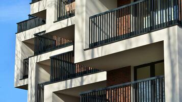 Modern and new apartment building. Multistoried modern, new and stylish living block of flats. photo