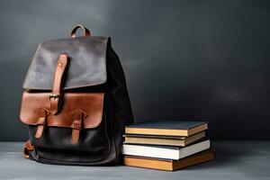 School bag and stacked of book photo