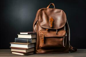 School bag and stacked of book photo