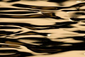 Flowing ripple pattern, golden background, 3d rendering. photo