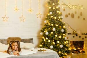 Adorable girl waiting for Santa photo