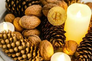 Gold bitcoin money with cones on a wooden background photo