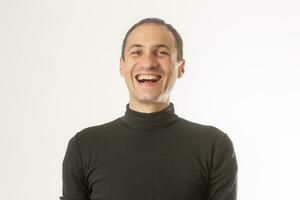 Portrait of a handsome young man smiling against white background photo