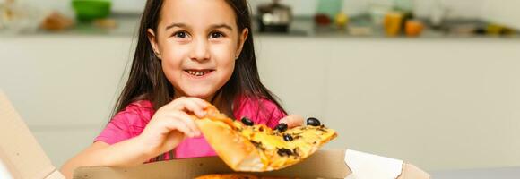 Pretty girls smiling when drinking juice and eating pizza photo