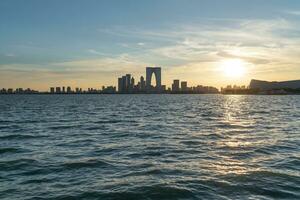 City buildings by Jinji Lake in Suzhou, China. photo