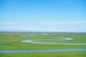 Winding rivers and meadows. Photo in Bayinbuluke Grassland in Xinjiang, China.