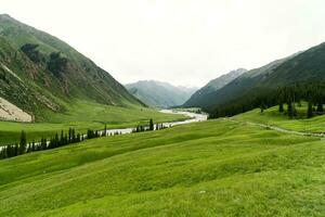 River and mountains with white clouds. photo