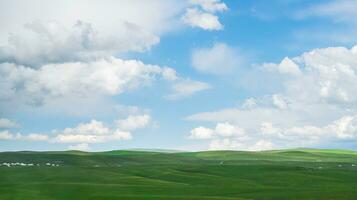 Grassland and mountains in a sunny day. Photo in Kalajun grassland in Xinjiang, China.