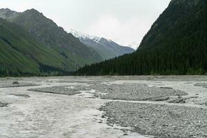 River and mountains with white clouds. photo