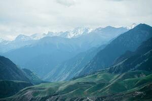 Snowy mountains and peaks in a sunny day. photo