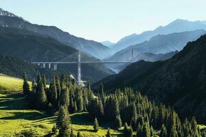 The bridge between the mountains. Guozigou Bridge in Xinjiang, China. photo