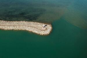 Road and lighthouses on the lake. Shot in Sayram Lake in Xinjiang, China. photo