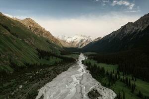 River and mountains with white clouds. photo