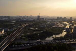 Industry and smokestack, Suzhou cityscape at sunset. photo