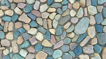 Stone texture for the background. Multicolored stone pavement photo