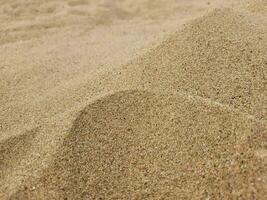 Background of sand dunes. Sand on the beach. photo
