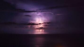 Purple lightning over the sea photo
