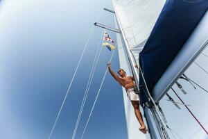 Handsome man on sailing ship photo