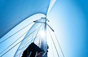 Sail over blue sky photo