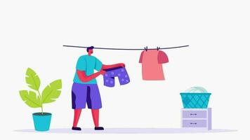 man hanging clothes on clothesline, man doing laundry, man hanging clothes on clothesline, man video