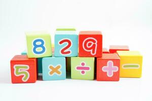 Number wood block cubes for learning Mathematic, education math concept. photo