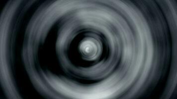 Swirling black and white energy vortex video