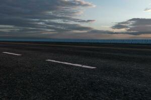 The empty Asphalt road and daylight sky and sunshine. photo