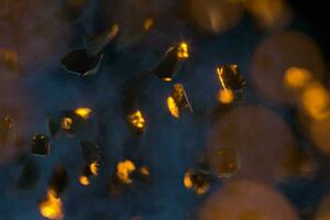 Broken gravels floating on black background, 3d rendering. photo