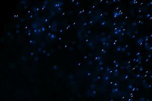 Flowing and glowing particles with dark background, 3d rendering photo