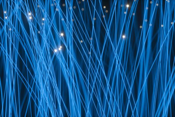 Flowing and glowing particles with dark background, 3d rendering
