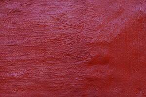 rough texture wall background painted dark red photo