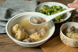 Corn and pork bone soup, delicious Chinese food. photo