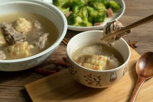 Corn and pork bone soup, delicious Chinese food. photo