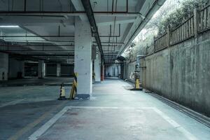 old parking lot with lighting, concrete building photo