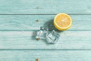 the fruit lemon on the blue table, cool light background photo