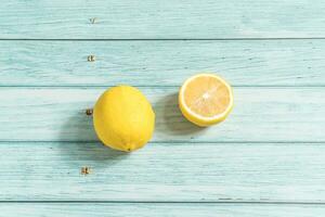the fruit lemon on the blue table, cool light background photo