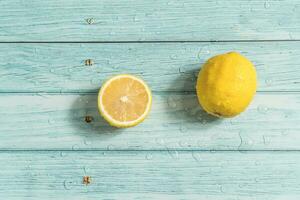 the fruit lemon on the blue table, cool light background photo